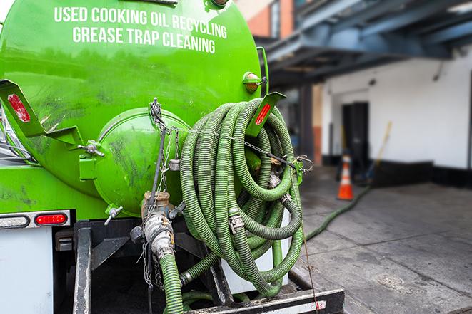 heavy-duty grease trap pumping equipment in action in Brownsville